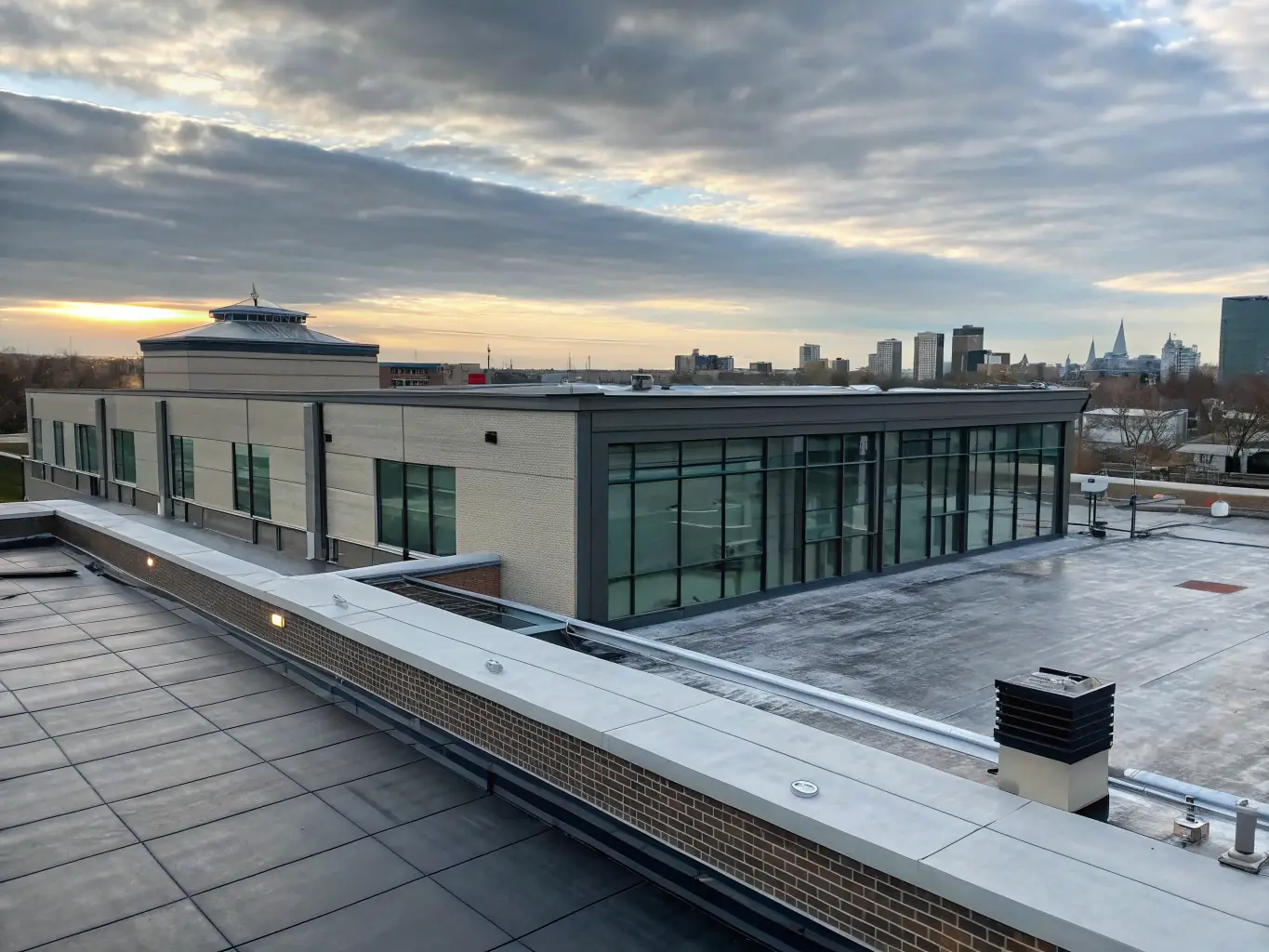 A commercial building with a flat roof, featuring a durable and energy-efficient roofing system. The image should emphasize the reliability and longevity of the commercial roofing solution.
